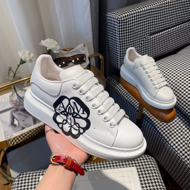OVERSIZED SNEAKERS IN WHITE CALFSKIN WITH BLACK MONOGRAM LOGO