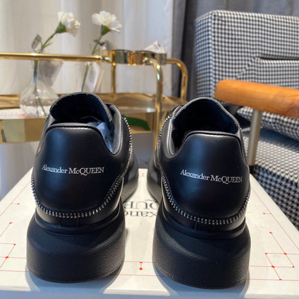 OVERSIZED SNEAKERS IN BLACK CALFSKIN WITH ZIPPER DETAIL AND SILVER LOGO HEEL