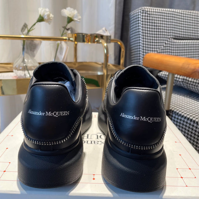 OVERSIZED SNEAKERS IN BLACK CALFSKIN WITH ZIPPER DETAIL AND SILVER LOGO HEEL