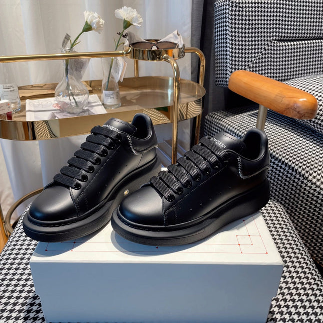 OVERSIZED SNEAKERS IN BLACK CALFSKIN WITH ZIPPER DETAIL AND SILVER LOGO HEEL