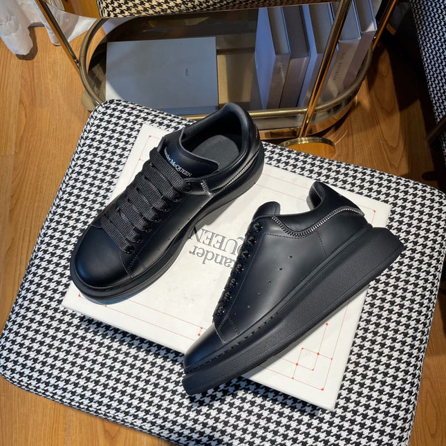 OVERSIZED SNEAKERS IN BLACK CALFSKIN WITH ZIPPER DETAIL AND SILVER LOGO HEEL