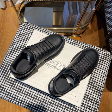 OVERSIZED SNEAKERS IN BLACK CALFSKIN WITH ZIPPER DETAIL AND SILVER LOGO HEEL