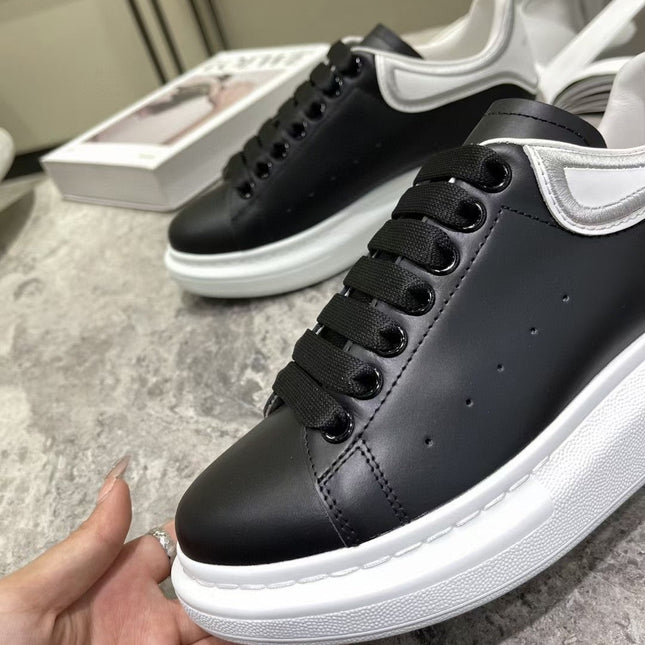 OVERSIZED SNEAKER IN BLACK CALFSKIN WITH SILVER STITCHED WHITE HEEL TAB