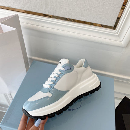 PRADA 25S THICK SOLE SNEAKER IN WHITE AND LIGHT BLUE CALFSKIN