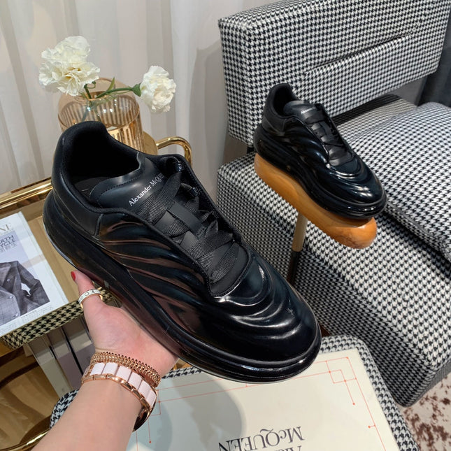 OVERSIZED SNEAKERS IN BLACK SHINY CALFSKIN WAVE PATTERN AND BLACK SOLE