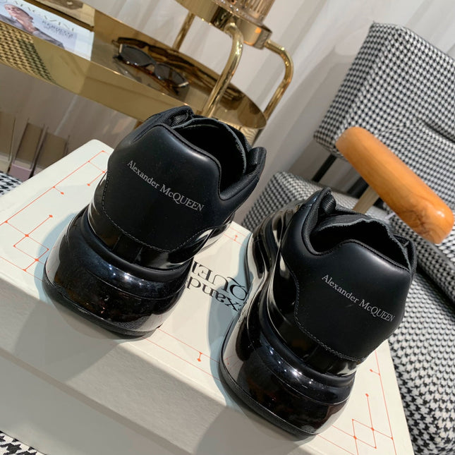 OVERSIZED SNEAKERS IN BLACK SHINY CALFSKIN WAVE PATTERN AND BLACK SOLE