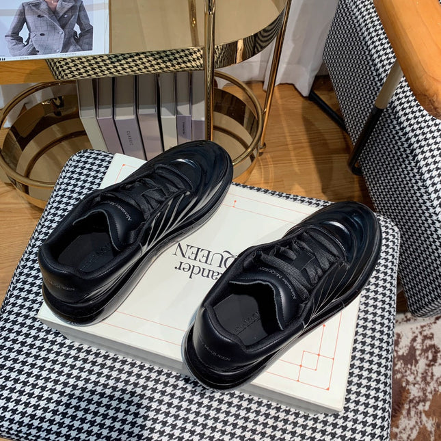 OVERSIZED SNEAKERS IN BLACK SHINY CALFSKIN WAVE PATTERN AND BLACK SOLE