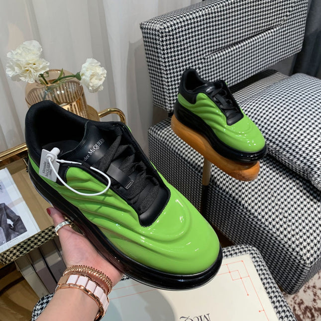 OVERSIZED SNEAKERS IN LIGHT GREEN SHINY CALFSKIN WAVE PATTERN AND BLACK SOLE