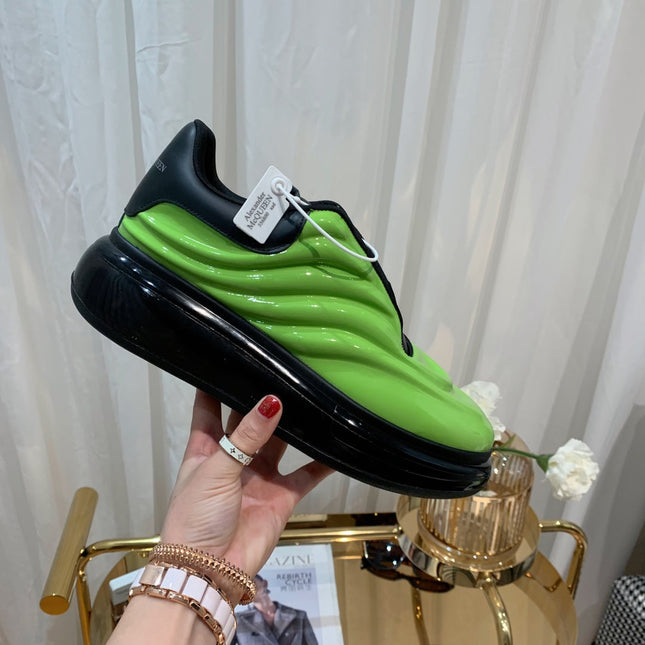 OVERSIZED SNEAKERS IN LIGHT GREEN SHINY CALFSKIN WAVE PATTERN AND BLACK SOLE