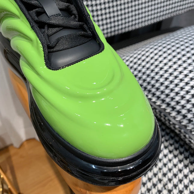 OVERSIZED SNEAKERS IN LIGHT GREEN SHINY CALFSKIN WAVE PATTERN AND BLACK SOLE