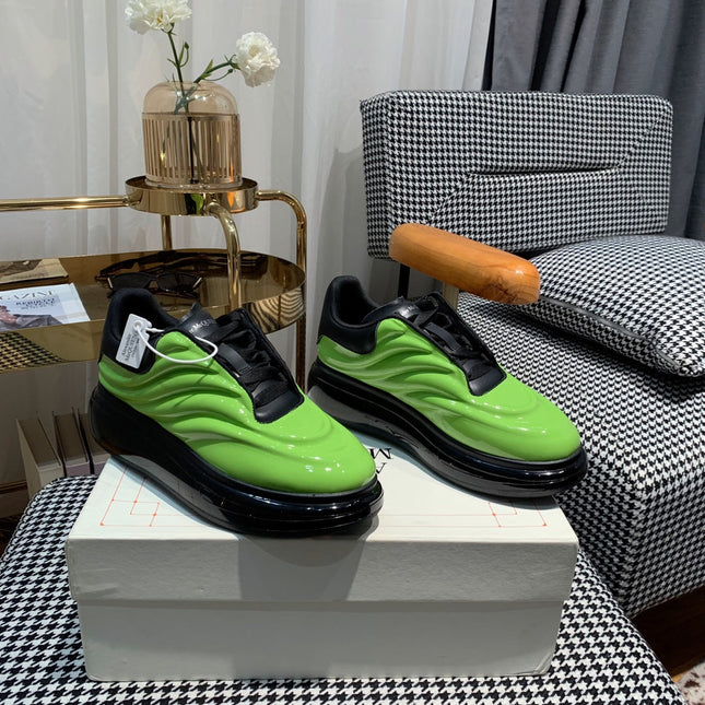 OVERSIZED SNEAKERS IN LIGHT GREEN SHINY CALFSKIN WAVE PATTERN AND BLACK SOLE