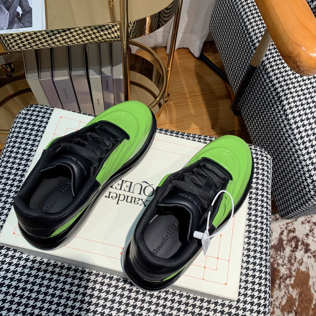 OVERSIZED SNEAKERS IN LIGHT GREEN SHINY CALFSKIN WAVE PATTERN AND BLACK SOLE