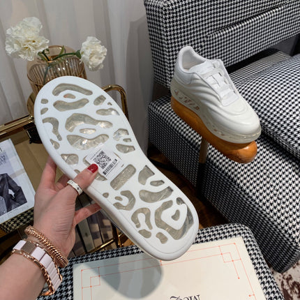 OVERSIZED SNEAKERS IN WHITE CALFSKIN WITH WAVE PATTERN AND CLEAR SOLE