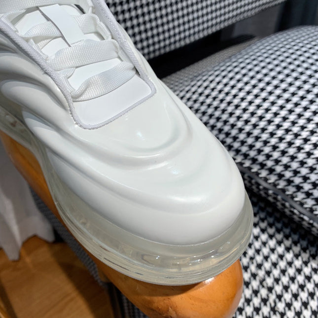 OVERSIZED SNEAKERS IN WHITE CALFSKIN WITH WAVE PATTERN AND CLEAR SOLE