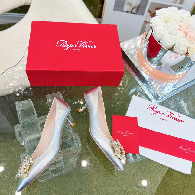 EFFLORESCENCE POINTED-TOE PUMPS IN SILVER SATIN WITH CRYSTAL BUCKLE