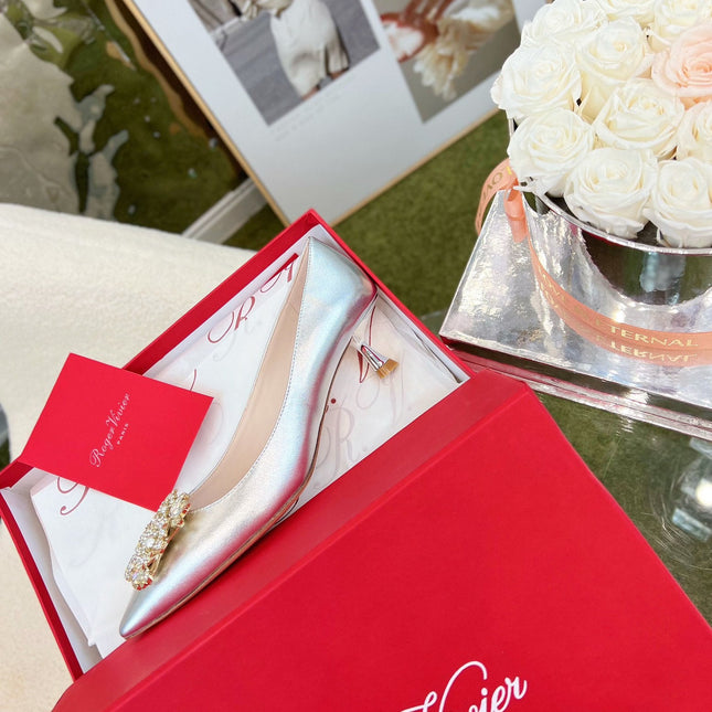 EFFLORESCENCE POINTED-TOE PUMPS IN SILVER SATIN WITH CRYSTAL BUCKLE