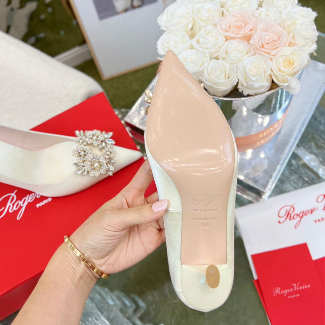 EFFLORESCENCE POINTED-TOE PUMPS IN WHITE SATIN WITH CRYSTAL BUCKLE