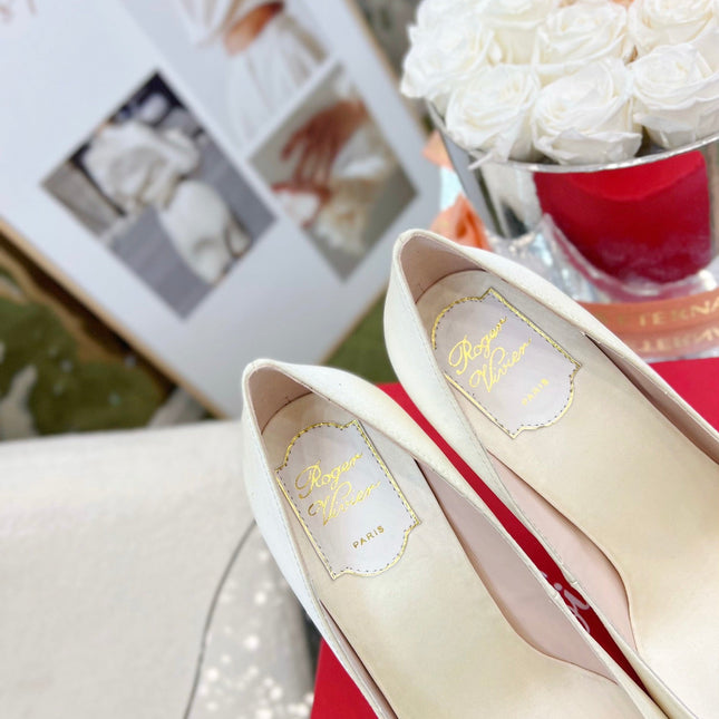 EFFLORESCENCE POINTED-TOE PUMPS IN WHITE SATIN WITH CRYSTAL BUCKLE
