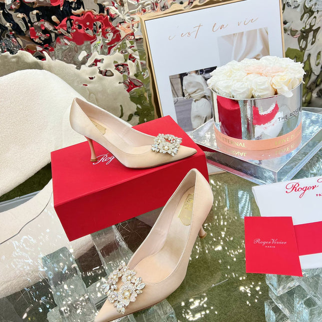 EFFLORESCENCE POINTED-TOE PUMPS IN NUDE SATIN WITH CRYSTAL BUCKLE