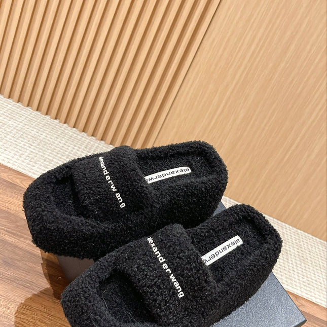 CHUNKY PLATFORM SIPPERS IN BLACK LAMBSWOOL