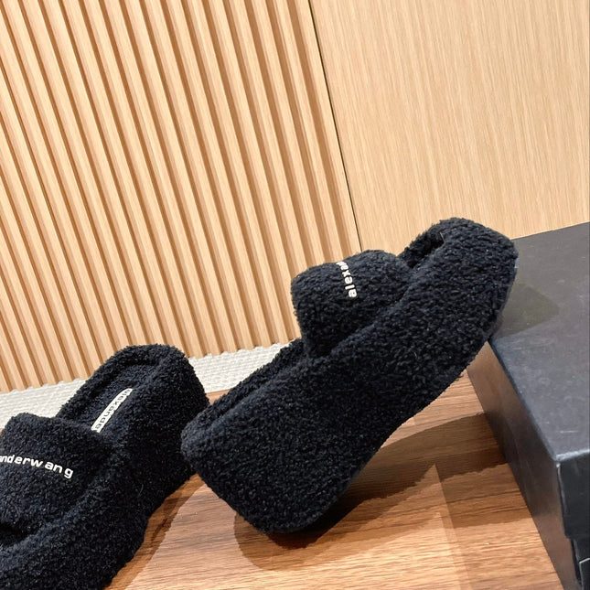 CHUNKY PLATFORM SIPPERS IN BLACK LAMBSWOOL