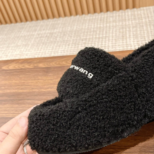 CHUNKY PLATFORM SIPPERS IN BLACK LAMBSWOOL