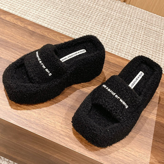 CHUNKY PLATFORM SIPPERS IN BLACK LAMBSWOOL