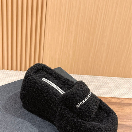 CHUNKY PLATFORM SIPPERS IN BLACK LAMBSWOOL