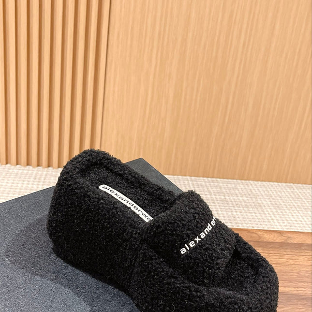 CHUNKY PLATFORM SIPPERS IN BLACK LAMBSWOOL