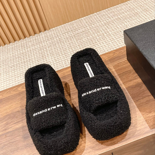 CHUNKY PLATFORM SIPPERS IN BLACK LAMBSWOOL