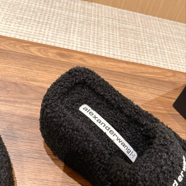 CHUNKY PLATFORM SIPPERS IN BLACK LAMBSWOOL