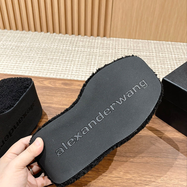 CHUNKY PLATFORM SIPPERS IN BLACK LAMBSWOOL