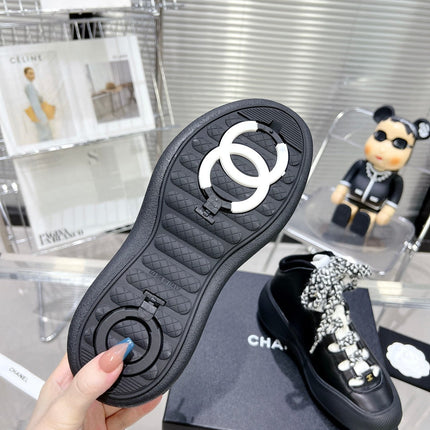 CC CANO ALTO SNEAKER IN BLACK CALFSKIN AND RUBBER