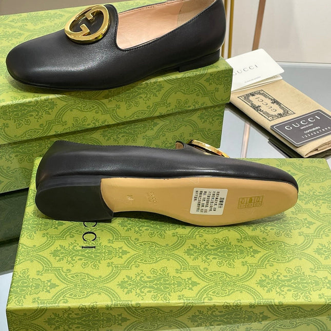 BLONDIE LOGO-PLAQUE LOAFERS IN BLACK CALFSKIN WITH GOLD HARDWARE