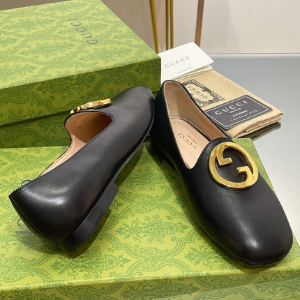 BLONDIE LOGO-PLAQUE LOAFERS IN BLACK CALFSKIN WITH GOLD HARDWARE