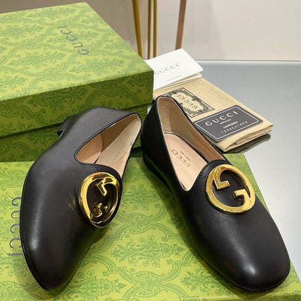 BLONDIE LOGO-PLAQUE LOAFERS IN BLACK CALFSKIN WITH GOLD HARDWARE