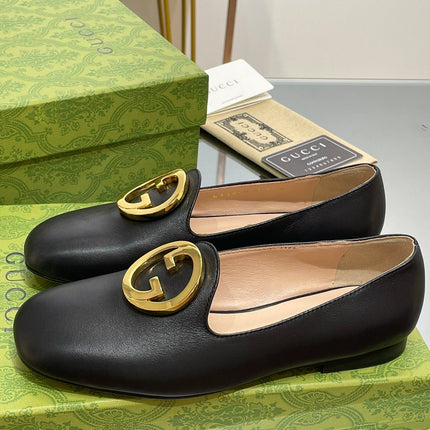 BLONDIE LOGO-PLAQUE LOAFERS IN BLACK CALFSKIN WITH GOLD HARDWARE
