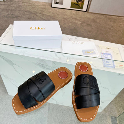 WOODY MULE IN BLACK LAMBSKIN WITH EMBROIDERED LOGO
