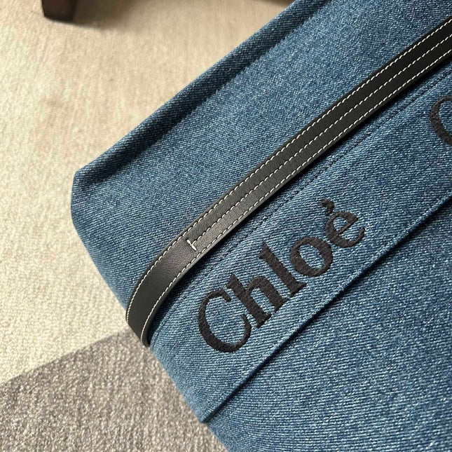 MEDIUM WOODY TOTE BAG 37 IN BLUE DENIM BLACK CALFSKIN