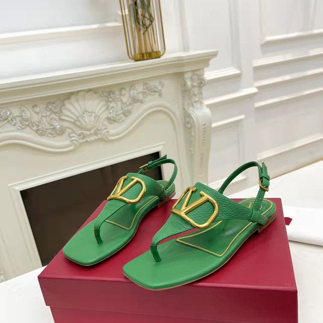THONG SANDALS IN EMERALD GREEN CALFSKIN WITH GOLD LOGO