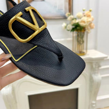 THONG SANDALS IN BLACK CALFSKIN WITH GOLD LOGO