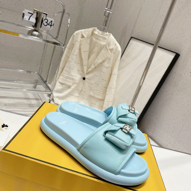 FENDI BAGUETTE SLIPPERS IN SKY BLUE LAMBSKIN WITH GOLD HARDWARE