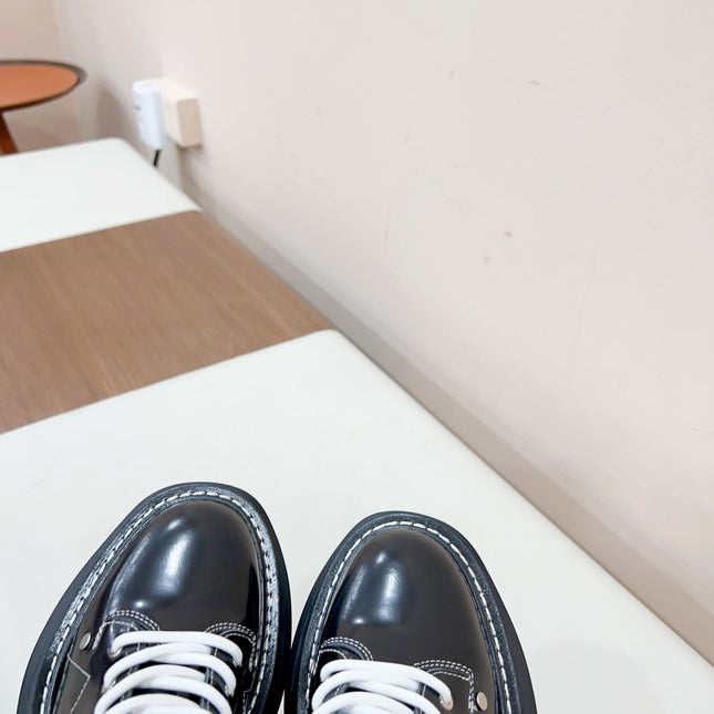 MCQUEEN LEATHER ANKLE BOOT IN BLACK MIX WHITE LAMBSKIN