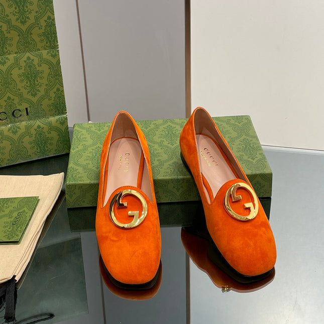 BLONDIE LOGO-PLAQUE LOAFERS IN TIGER ORANGE SUEDE WITH GOLD HARDWARE
