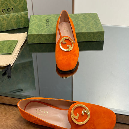 BLONDIE LOGO-PLAQUE LOAFERS IN TIGER ORANGE SUEDE WITH GOLD HARDWARE