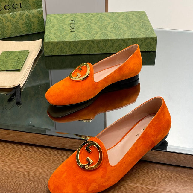 BLONDIE LOGO-PLAQUE LOAFERS IN TIGER ORANGE SUEDE WITH GOLD HARDWARE