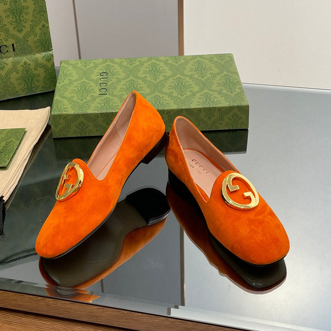 BLONDIE LOGO-PLAQUE LOAFERS IN TIGER ORANGE SUEDE WITH GOLD HARDWARE