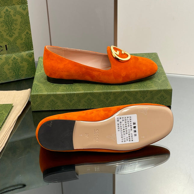 BLONDIE LOGO-PLAQUE LOAFERS IN TIGER ORANGE SUEDE WITH GOLD HARDWARE