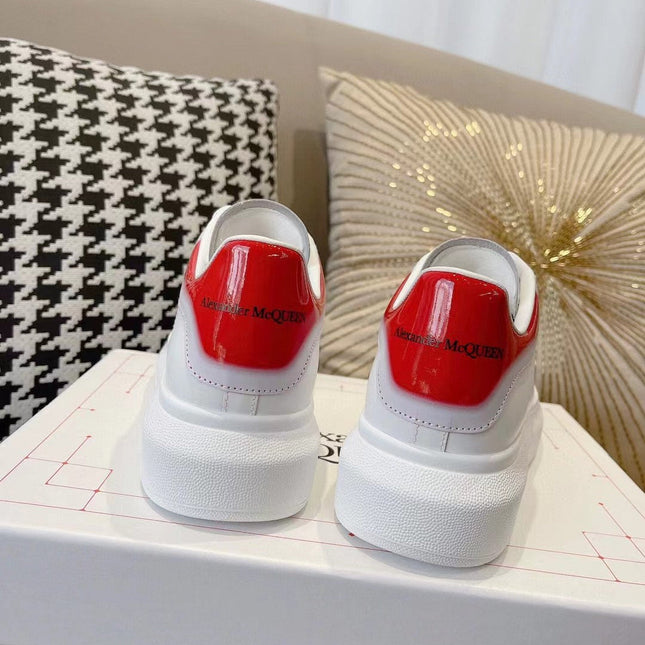 OVERSIZED SNEAKER IN WHITE CALFSKIN WITH GLOSSY RED AND WHITE HEEL TAB
