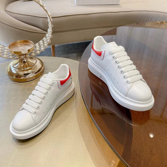 OVERSIZED SNEAKER IN WHITE CALFSKIN WITH GLOSSY RED AND WHITE HEEL TAB